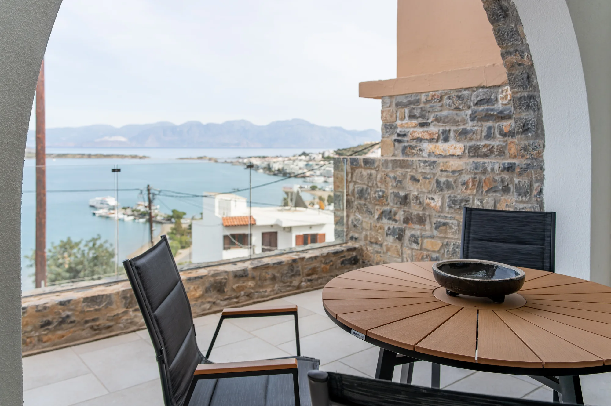Stone-arched private terrace overlooking Elounda Bay